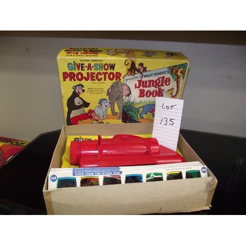 135 - A Chad valley Give-A-Show projector in box complete with slides, Walt Disney, Jungle Book etc.