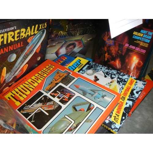 25 - A shelf of assorted annuals including Thunderbirds, TV 21, Fireball, Scorcher etc.,