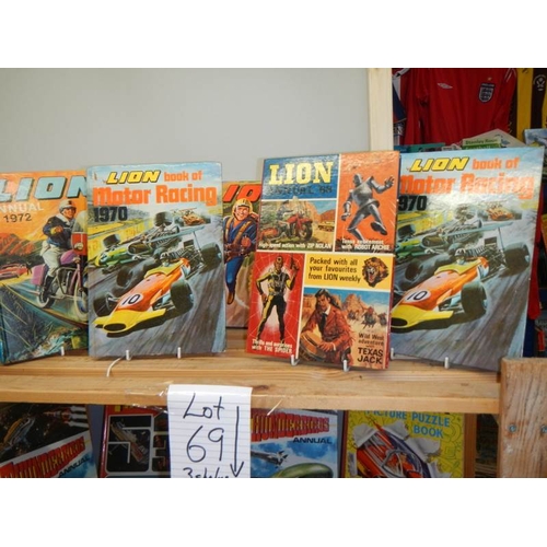 69 - Three shelves of interesting books and magazines including Lion annuals, Thunderbirds etc.,