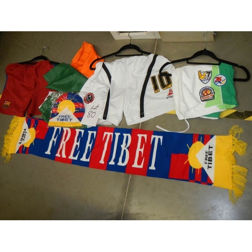 80 - A mixed lot of football related items including shorts, scarf etc.,
