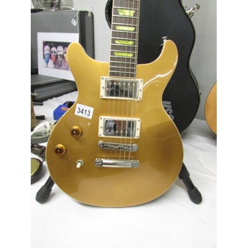 3413 - A USA Gold Gibson ''Classic'' Les Paul left hand guitar with original hard case.