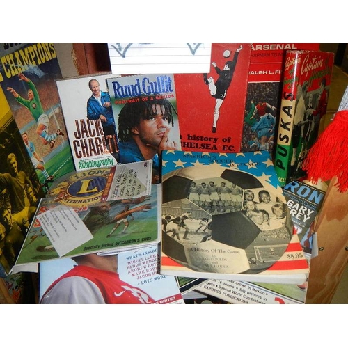 13 - Five shelves of football magazines, hardback and paperback books etc.,