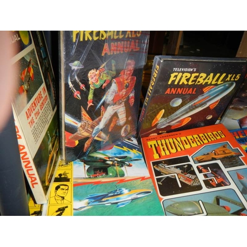 25 - A shelf of assorted annuals including Thunderbirds, TV 21, Fireball, Scorcher etc.,