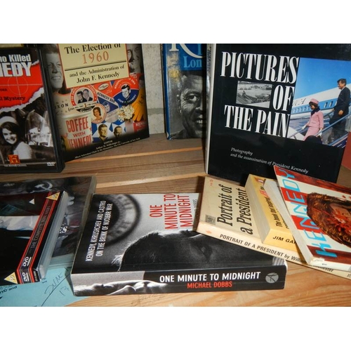 26 - Three shelves of JFK hardback books. paperback books and other memorabilia etc.,