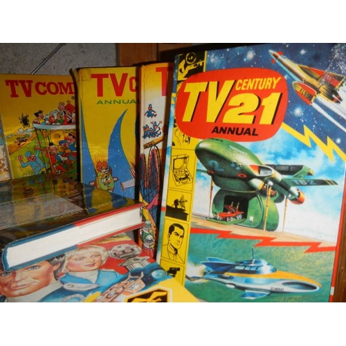 27 - A shelf of assorted annuals including TV 21, TV Comic, Sting Ray etc.,