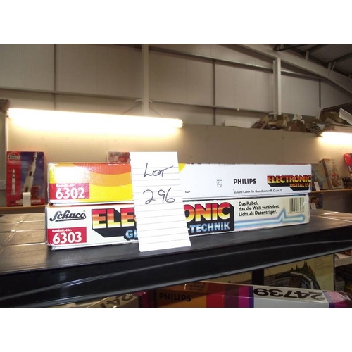 296 - 2 Philips/Schuco electronic sets, 6302 and 6303, both sealed inside,  being sold as seen, collect on... 