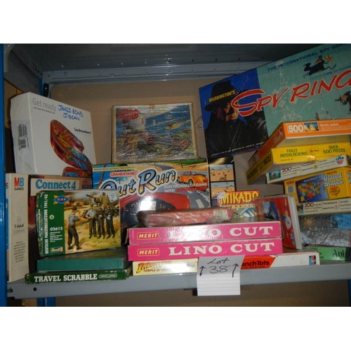 38 - A large shelf of puzzles and games.