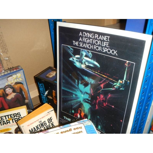 40 - A large shelf of Star Trek collectables including Jigsaw puzzles, VHS, diecast etc., (Data figure bo... 