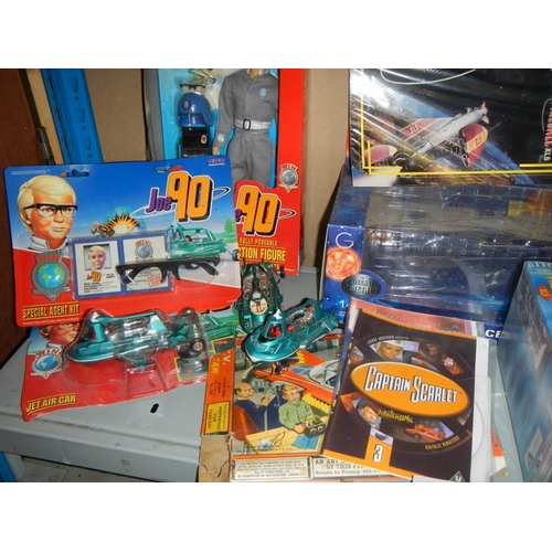 42 - A large shelf of Fireball and Joe 90 toys and videos etc.,