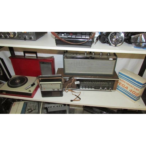 1012 - A Vega 402 transistor radio, a Thorn SA102 transistor radio, a Grundig RF111 transistor radio, and a... 