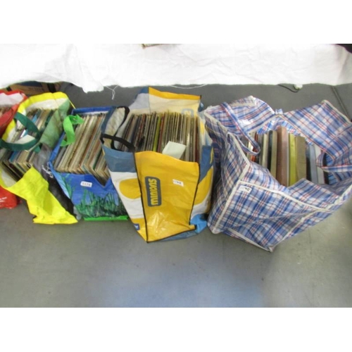 1175 - 5 large bags of LP records, unsorted.