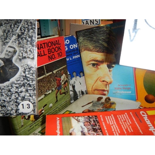 13 - Five shelves of football magazines, hardback and paperback books etc.,