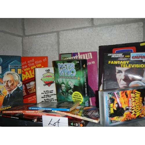 33 - One shelf of assorted Doctor Who books and memorabilia etc.,