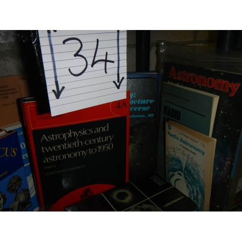 34 - Two shelves of astronomy related books and magazines.