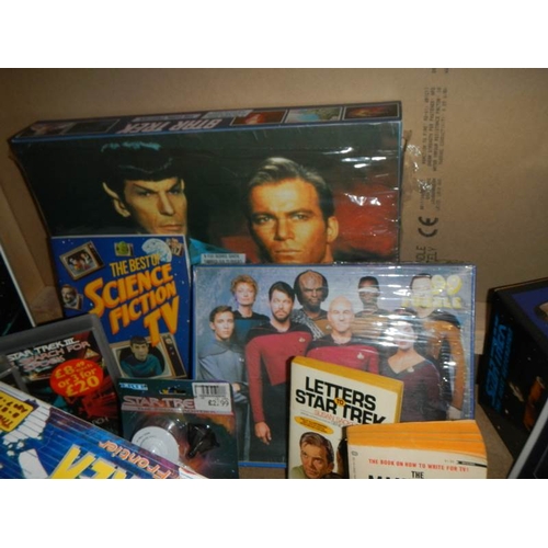 40 - A large shelf of Star Trek collectables including Jigsaw puzzles, VHS, diecast etc., (Data figure bo... 