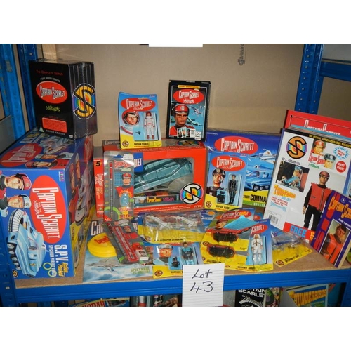 43 - A shelf of Captain Scarlett toys including figures, DVD's etc.,