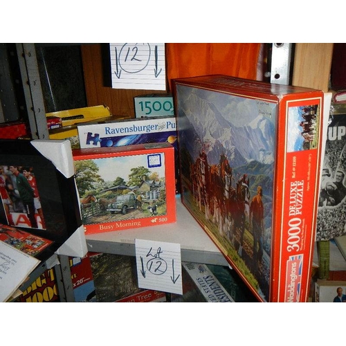 12 - 4 Shelves of jigsaw puzzles, approximately 24, all good