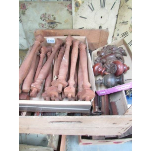 1298 - A box of wooden spindles etc.,