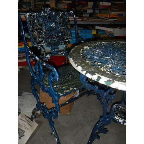 1359 - A metal circular garden table and 2 chairs,