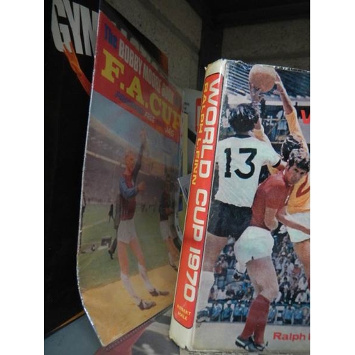 15 - A large shelf of football memorabilia - England, America etc.,