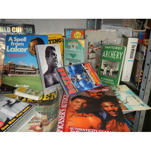 16 - A shelf of sports related memorabilia including Archery, boxing, cricket etc