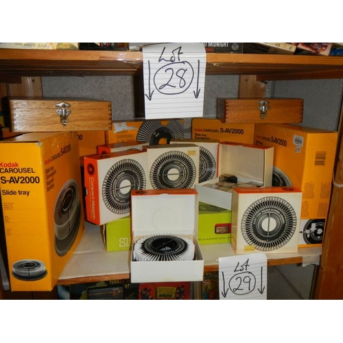 28 - A shelf of slide carriers including small disc complete with regulator.