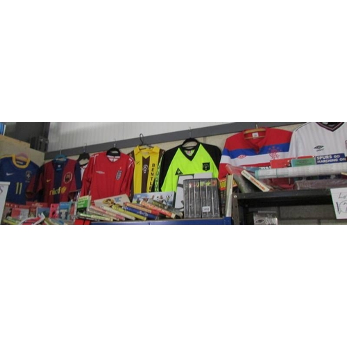 3808 - A good lot of football related items including Barcelona and Sheffield United shirts, books, videos ... 