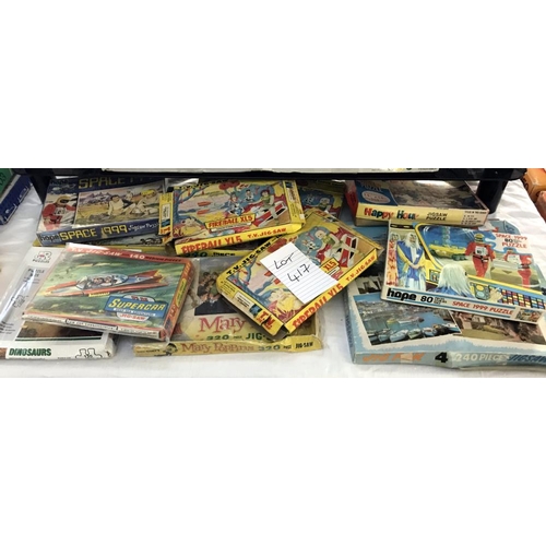 417 - A quantity of vintage jigsaws including Supercar, Fireball XL-5 & Space 1999 etc. Completeness unkno... 