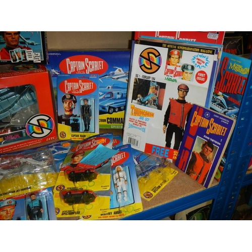 43 - A shelf of Captain Scarlett toys including figures, DVD's etc.,