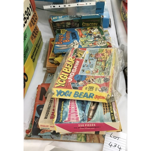 434 - A selection of vintage jigsaw puzzles including Thunderbirds, Z cars, & Yogi Bear etc. (completeness... 