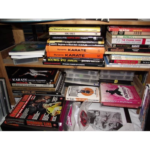 490 - A large quantity of Kung Fu collectors edition vhs videos, Bruce Lee framed prints and books on mart... 