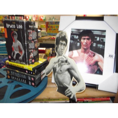 490 - A large quantity of Kung Fu collectors edition vhs videos, Bruce Lee framed prints and books on mart... 