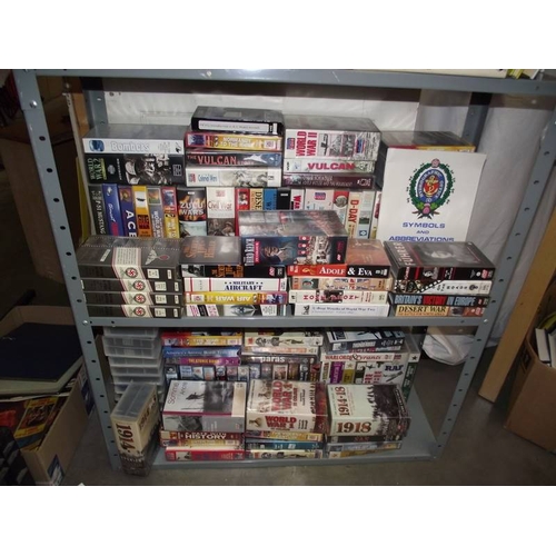 492 - A large quantity of books on war and videos, (6 shelves)