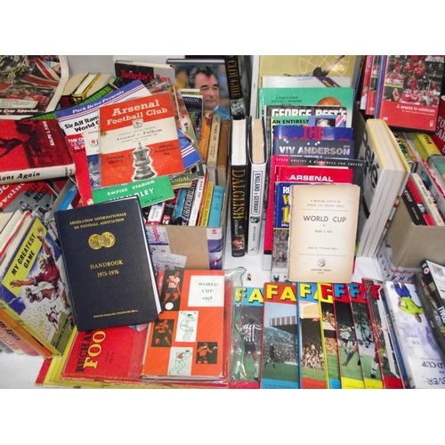 500 - A large collection of football related book and videos, also includes wall posted signed by Saint & ... 