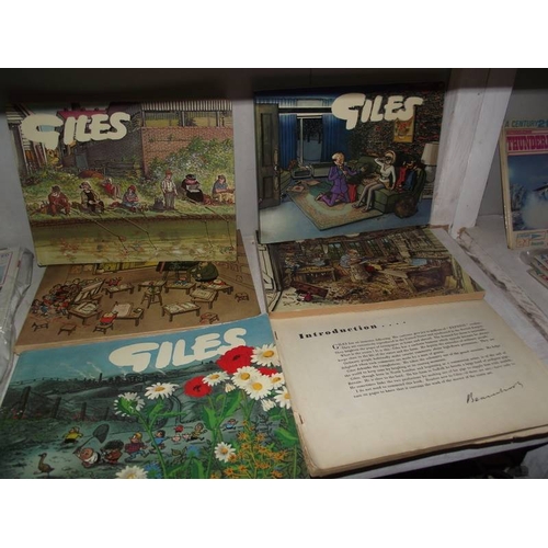 548 - A quantity of Giles books and an Andy Capp book.