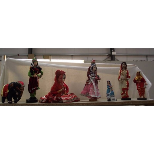 601 - A doll of a Rajasthani woman and other dolls.