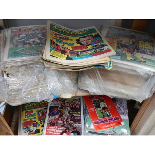 81 - A large lot of football related comics and magazines.