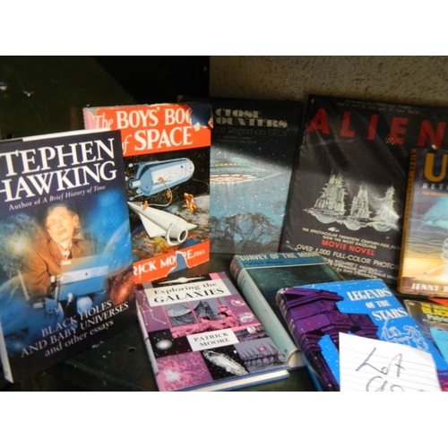 98 - A mixed lot of books including Patrick Moore, Stephen Hawking, UFO's etc.,
