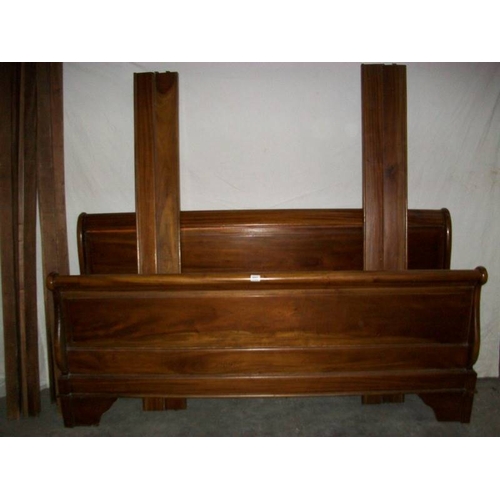 503 - A French Louis Baton solid mahogany bedstead, 6 foot wide and complete.