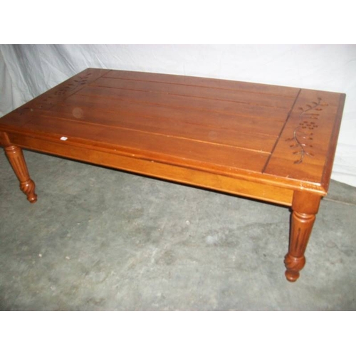 508 - A good solid mahogany side table on tapered legs with carving to top,  122 cm long, 67 cm wide and 4... 