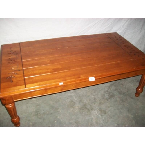 508 - A good solid mahogany side table on tapered legs with carving to top,  122 cm long, 67 cm wide and 4... 