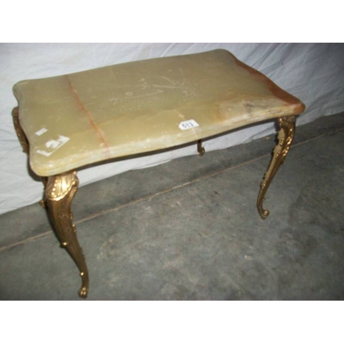 513 - A French style marble topped table on gilded legs, 80 x 38 x 40 cm (marking on top is a seam).