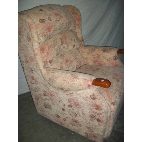 514 - A good mid to late 20th century armchair together with a matching recline/raise armchair, both in go... 