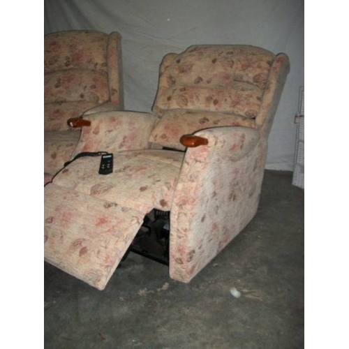 514 - A good mid to late 20th century armchair together with a matching recline/raise armchair, both in go... 