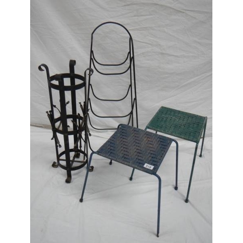 519 - An umbrella stand, 2 woven stop stools and a steel rack.