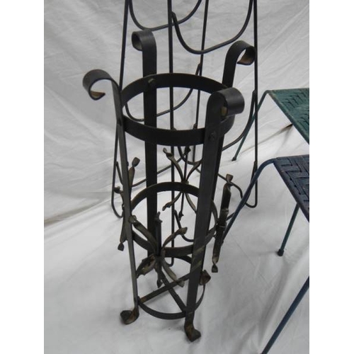 519 - An umbrella stand, 2 woven stop stools and a steel rack.