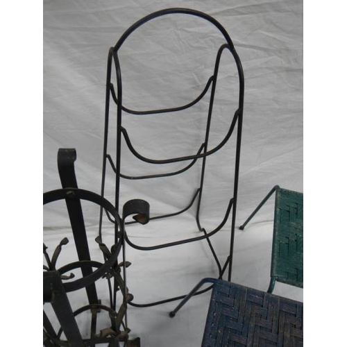 519 - An umbrella stand, 2 woven stop stools and a steel rack.