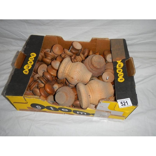 521 - A large box of mainly pine knobs and legs, most with screws.