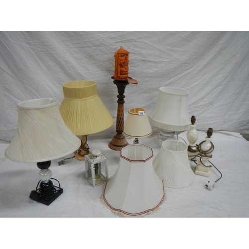 524 - 6 table lamps, a carriage candle holder and a new Novalum shimmering candle with stand.