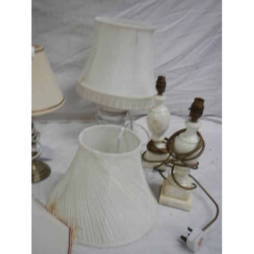 524 - 6 table lamps, a carriage candle holder and a new Novalum shimmering candle with stand.